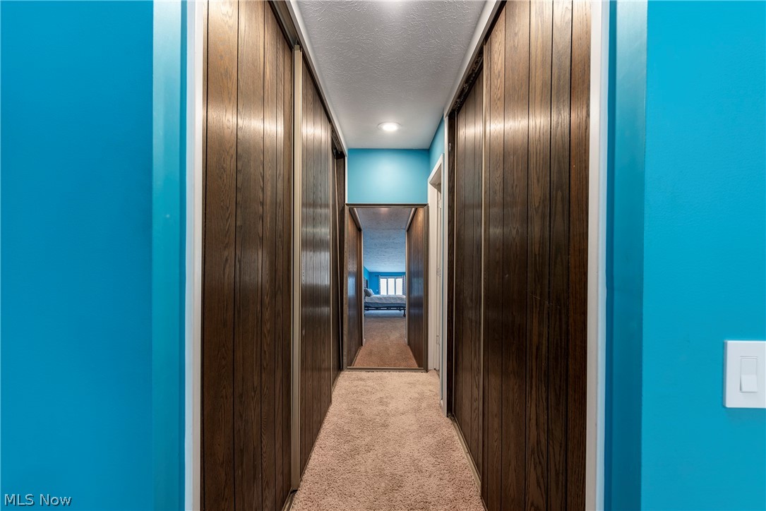 17364 Falling Water Road Strongsville, OH 44136 - Photo 24 of 36 Master Bedroom with Large Corridor of Closets with Built-ins