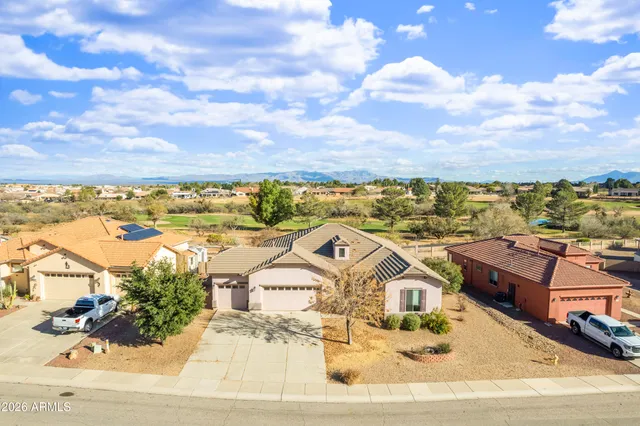 an aerial view of residential houses with outdoor space