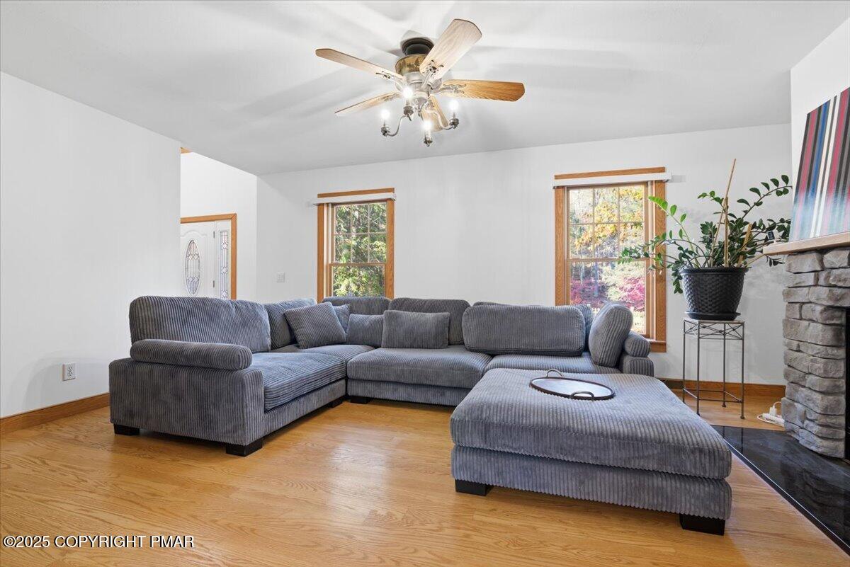 563 Pensyl Creek Road Stroudsburg, PA 18360 - Photo 13 of 143 a living room with furniture and a flat screen tv