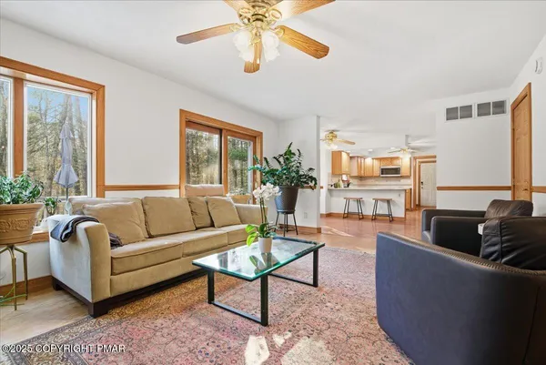 a bedroom with a bed and a couch