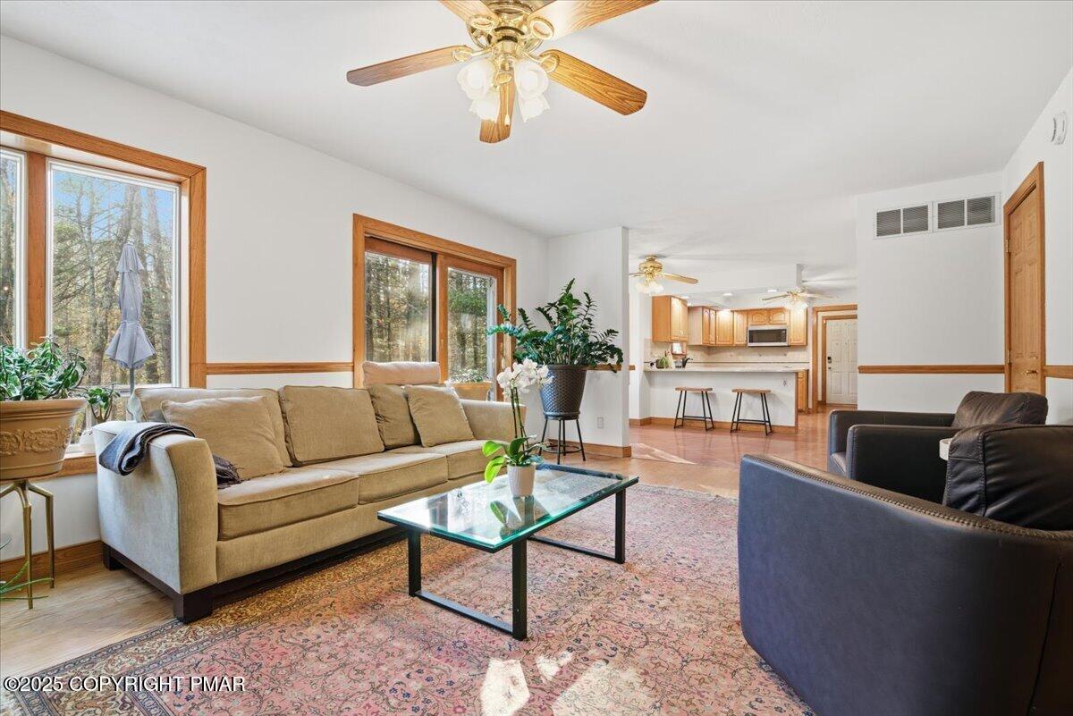 563 Pensyl Creek Road Stroudsburg, PA 18360 - Photo 15 of 143 a living room with furniture and a large window