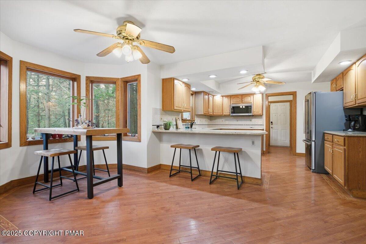 563 Pensyl Creek Road Stroudsburg, PA 18360 - Photo 19 of 143 a view of a dining room with furniture window and outside view