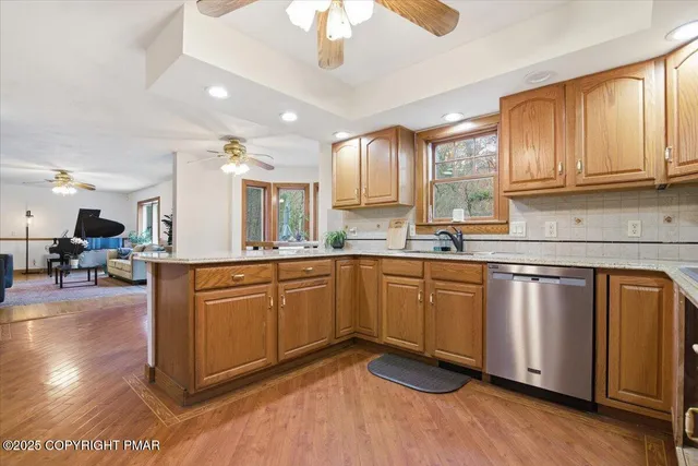 a living room with furniture window and wooden floor