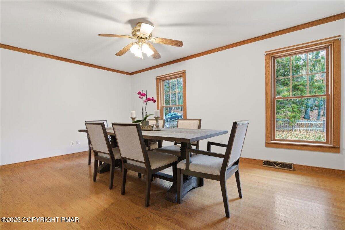 563 Pensyl Creek Road Stroudsburg, PA 18360 - Photo 28 of 143 a view of a dining room with furniture window and wooden floor