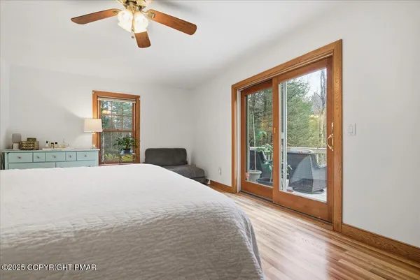 a living room with furniture and a dining table with kitchen view