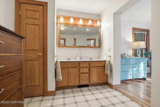a bathroom with a toilet and a shower curtain