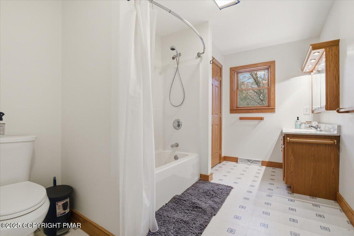 563 Pensyl Creek Road Stroudsburg, PA 18360 - Photo 58 of 143 a bathroom with a granite countertop sink a toilet and shower