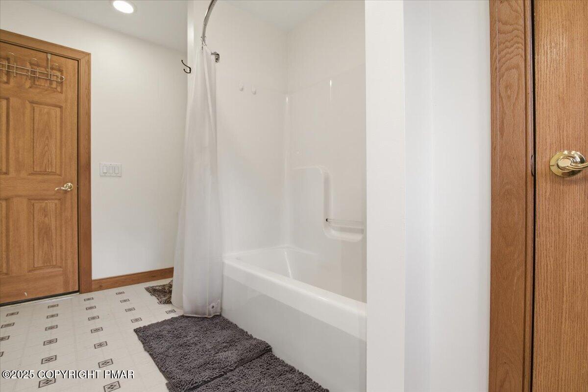 563 Pensyl Creek Road Stroudsburg, PA 18360 - Photo 60 of 143 a bathroom with a bathtub and a shower