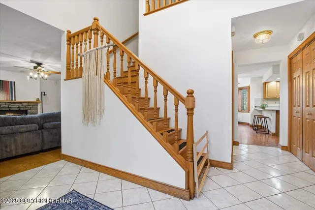 a kitchen with stainless steel appliances granite countertop a sink a stove cabinets and wooden floor