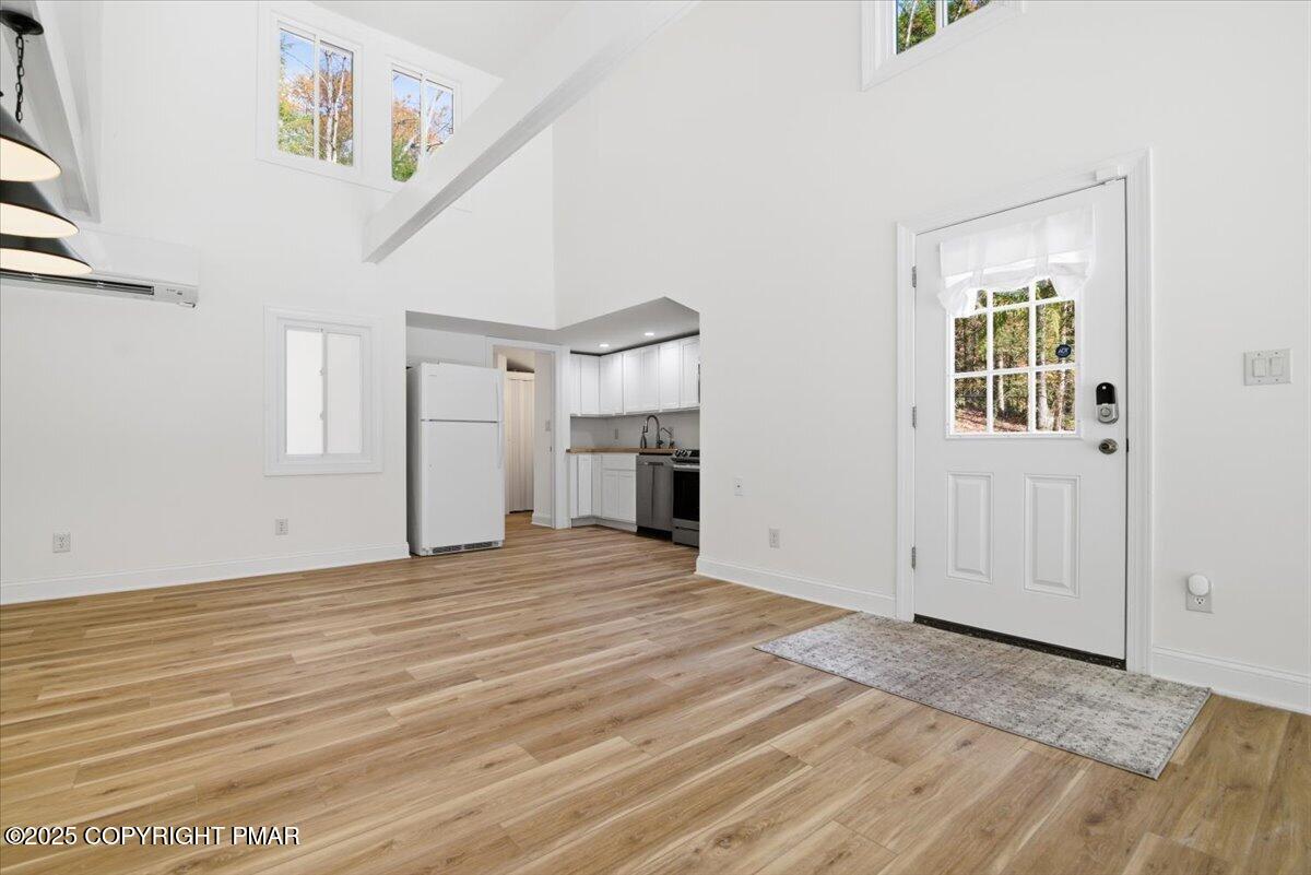 563 Pensyl Creek Road Stroudsburg, PA 18360 - Photo 82 of 143 a view of empty room with wooden floor and fireplace