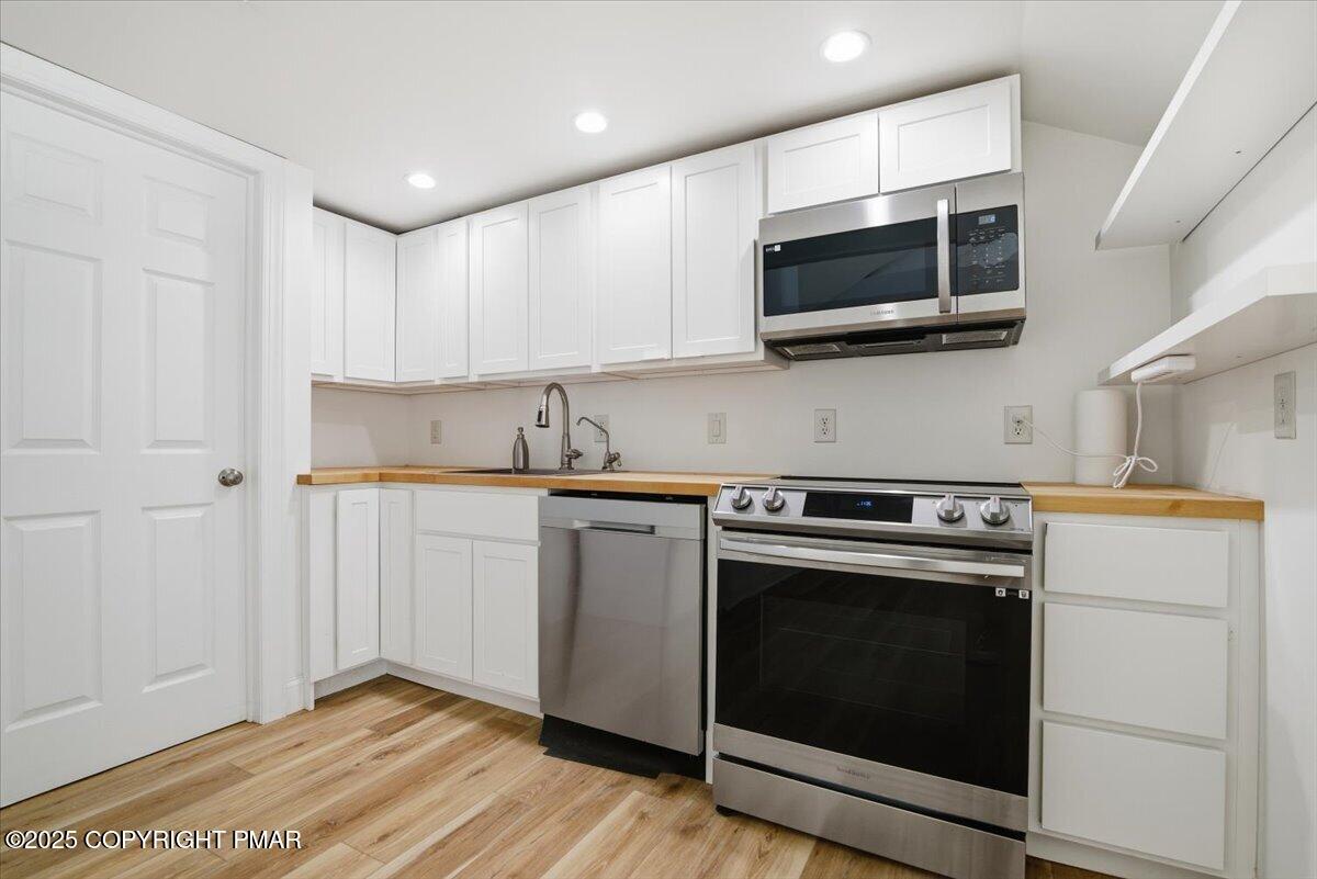 563 Pensyl Creek Road Stroudsburg, PA 18360 - Photo 98 of 143 a kitchen with a stove and a microwave