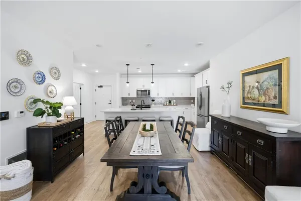 a view of a dining room with furniture and wooden floor