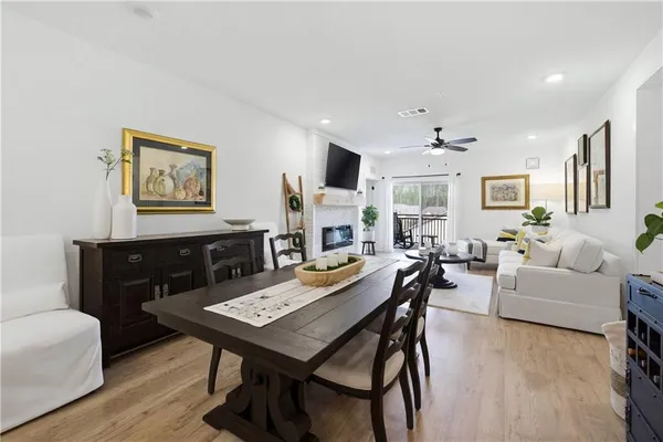 a view of a dining room with furniture and wooden floor
