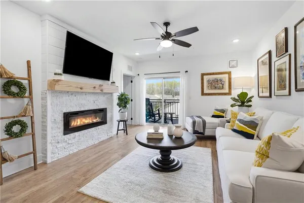 a living room with furniture and a flat screen tv