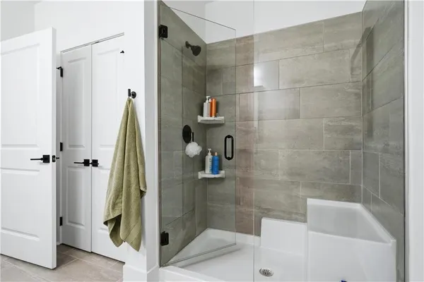 a bathroom with a shower and a sink