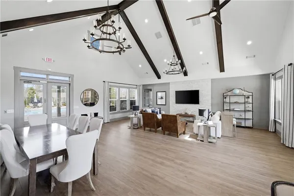 a living room with furniture a rug and a flat screen tv