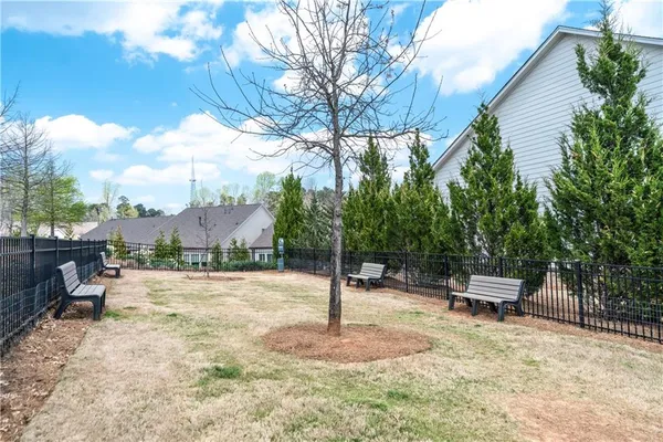 a swimming pool with outdoor seating and yard