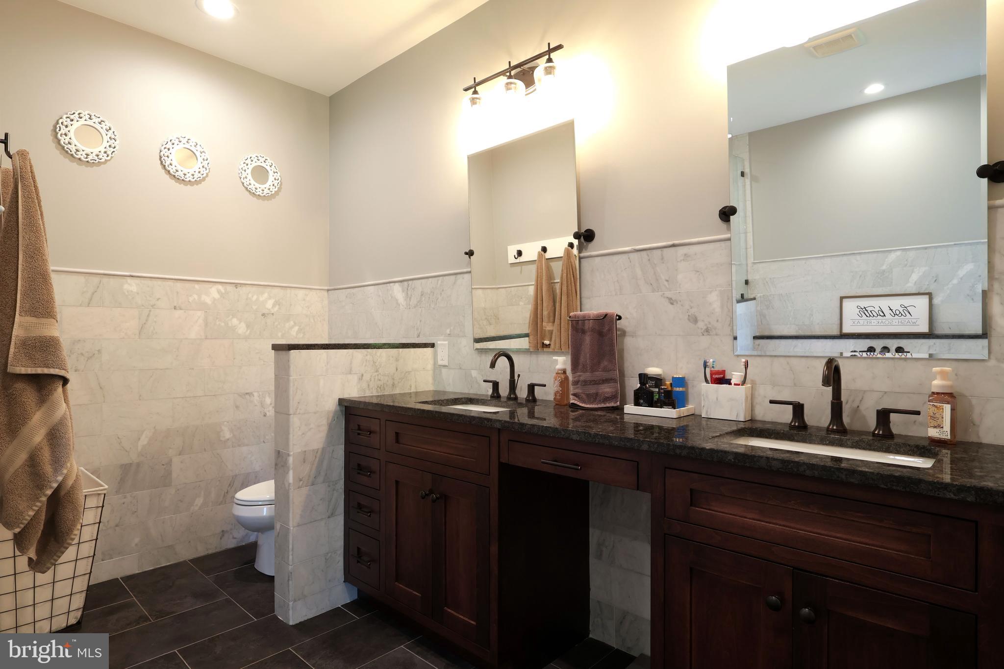 518 Two Mile Road Howard, PA 16841 - Photo 32 of 84 a bathroom with a granite countertop sink a toilet and a mirror