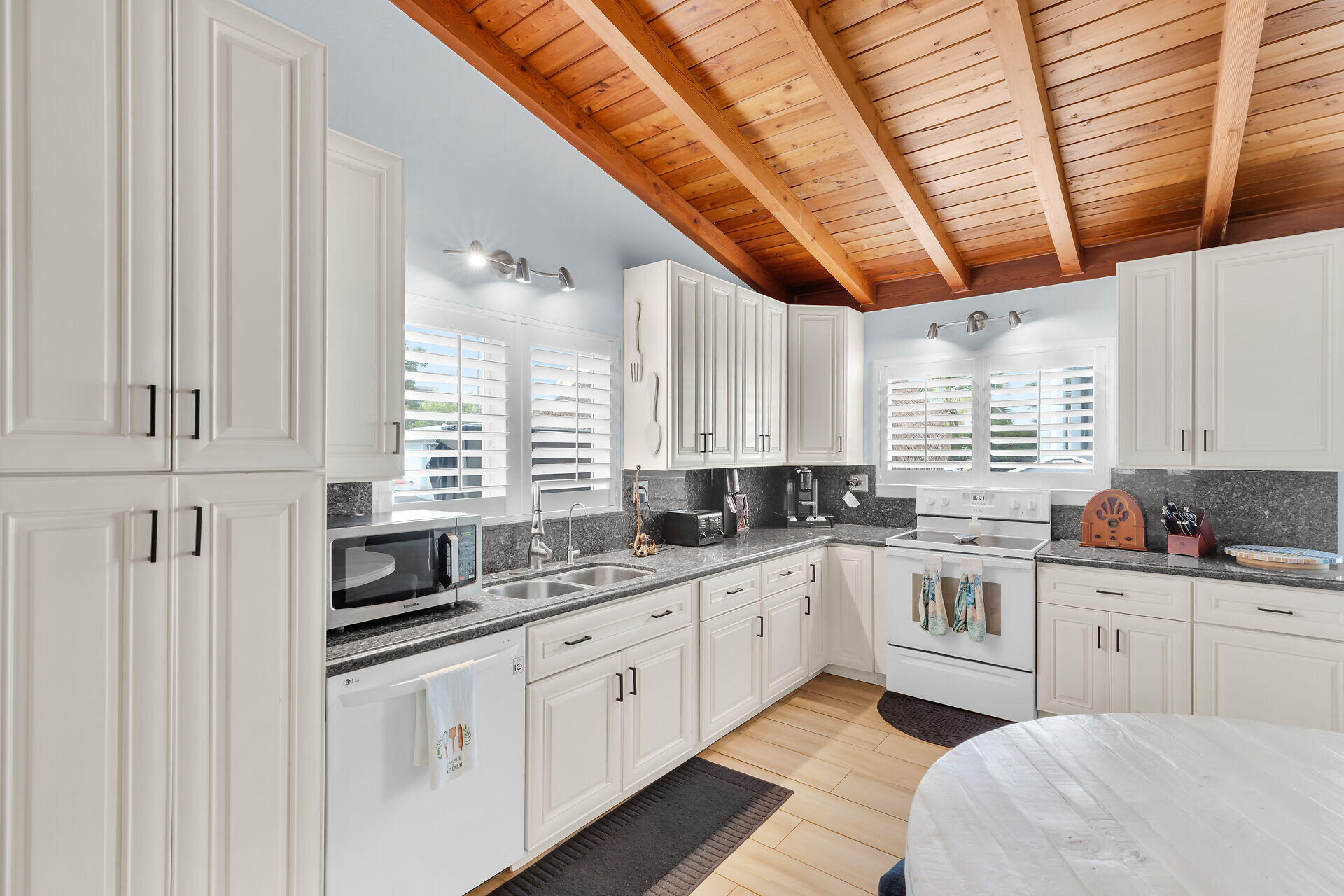 712 Grouper Lane Key Largo, FL 33037 - Photo 11 of 42 a kitchen with stainless steel appliances granite countertop a sink a window and cabinets