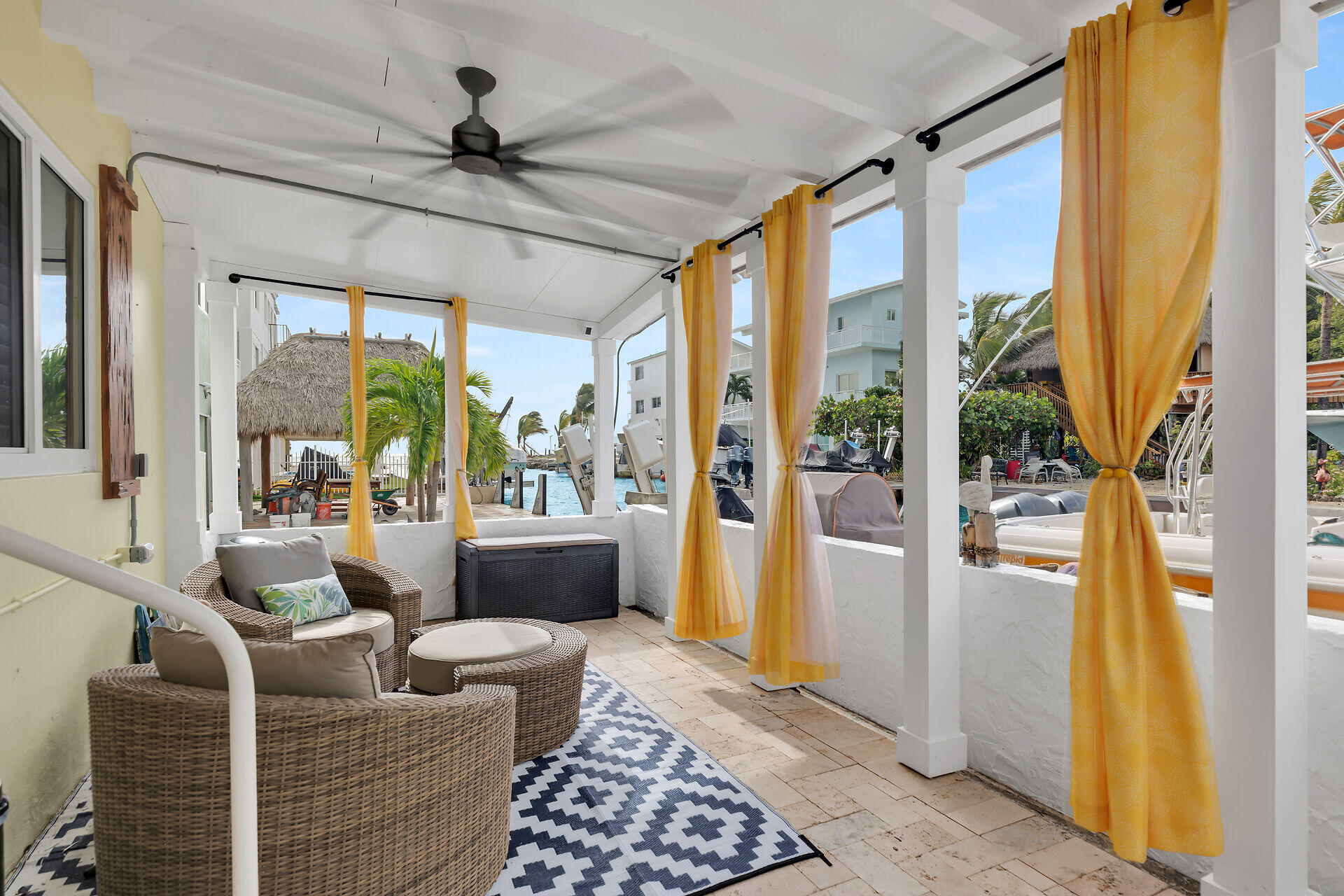 712 Grouper Lane Key Largo, FL 33037 - Photo 15 of 42 a living room with couch a table and a large window