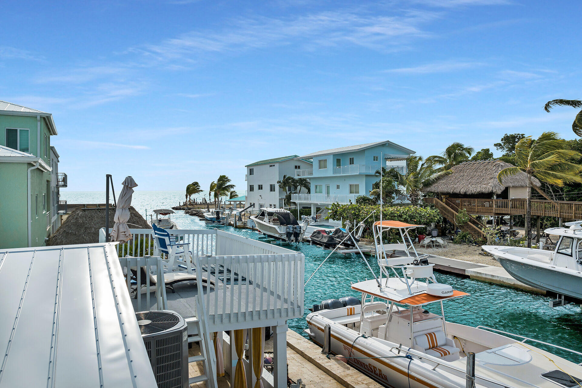 712 Grouper Lane Key Largo, FL 33037 - Photo 23 of 42 a view of a patio with chairs and table in patio