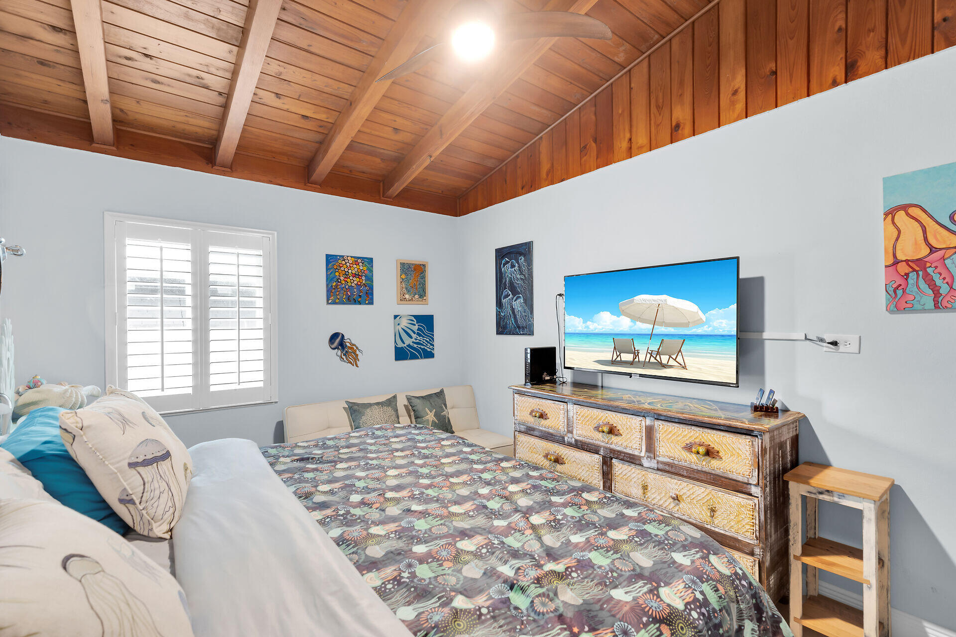 712 Grouper Lane Key Largo, FL 33037 - Photo 27 of 42 a bedroom with furniture and flat screen tv