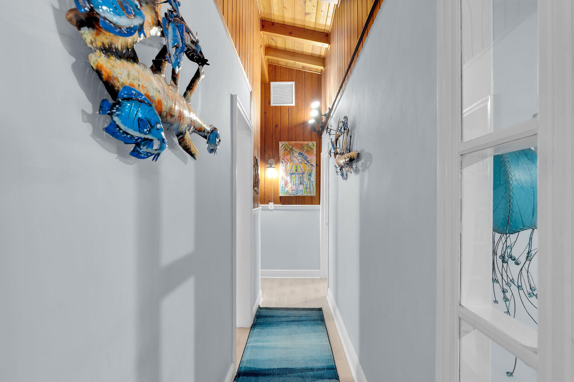 712 Grouper Lane Key Largo, FL 33037 - Photo 31 of 42 a view of a hallway with wooden floor and stairs