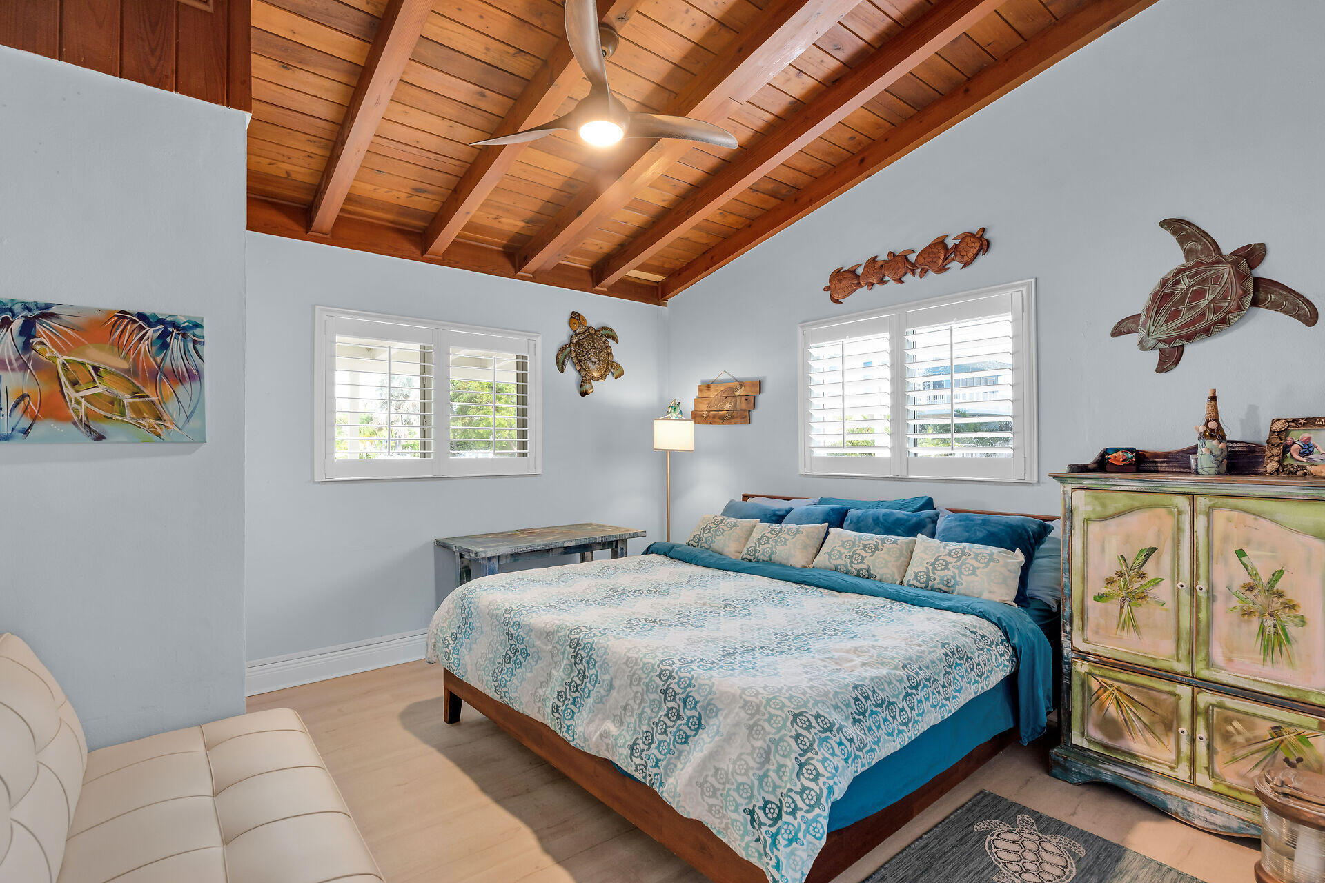 712 Grouper Lane Key Largo, FL 33037 - Photo 35 of 42 a bedroom with a bed a dresser next to a window