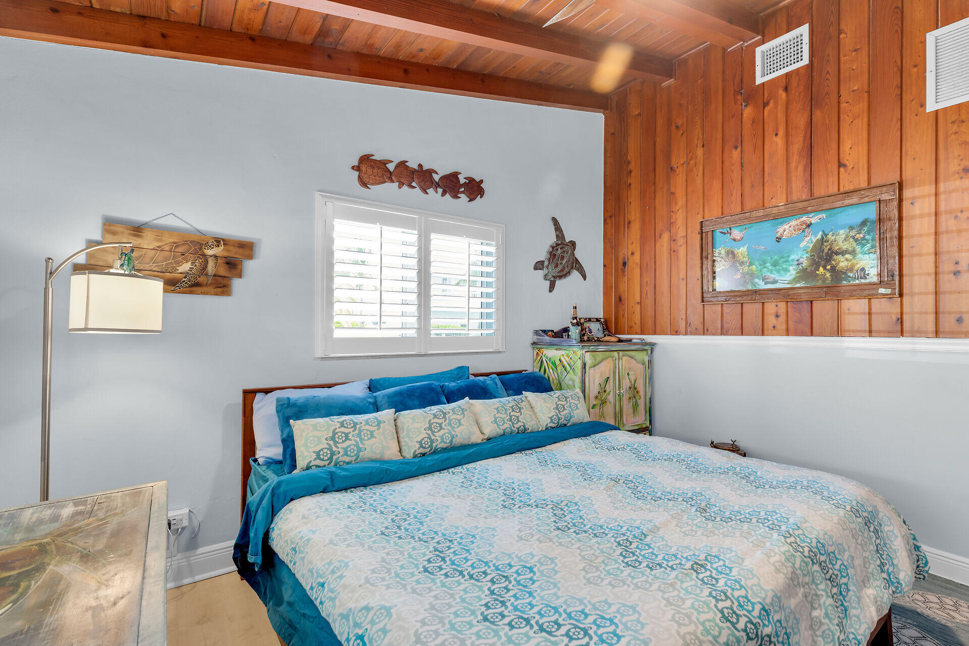 712 Grouper Lane Key Largo, FL 33037 - Photo 37 of 42 a bedroom with a bed and a window