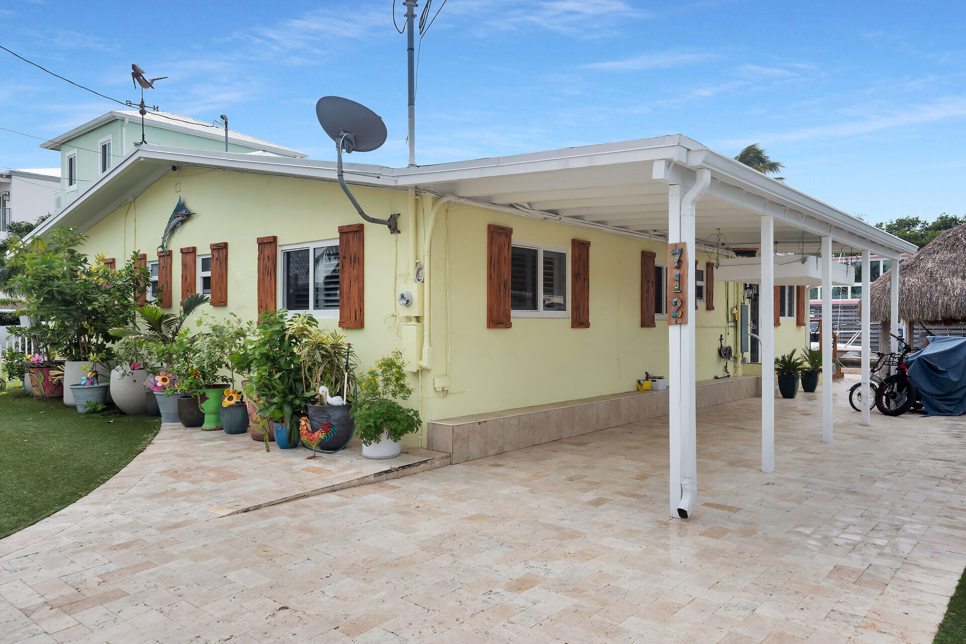 712 Grouper Lane Key Largo, FL 33037 - Photo 4 of 42 a front view of a house with porch