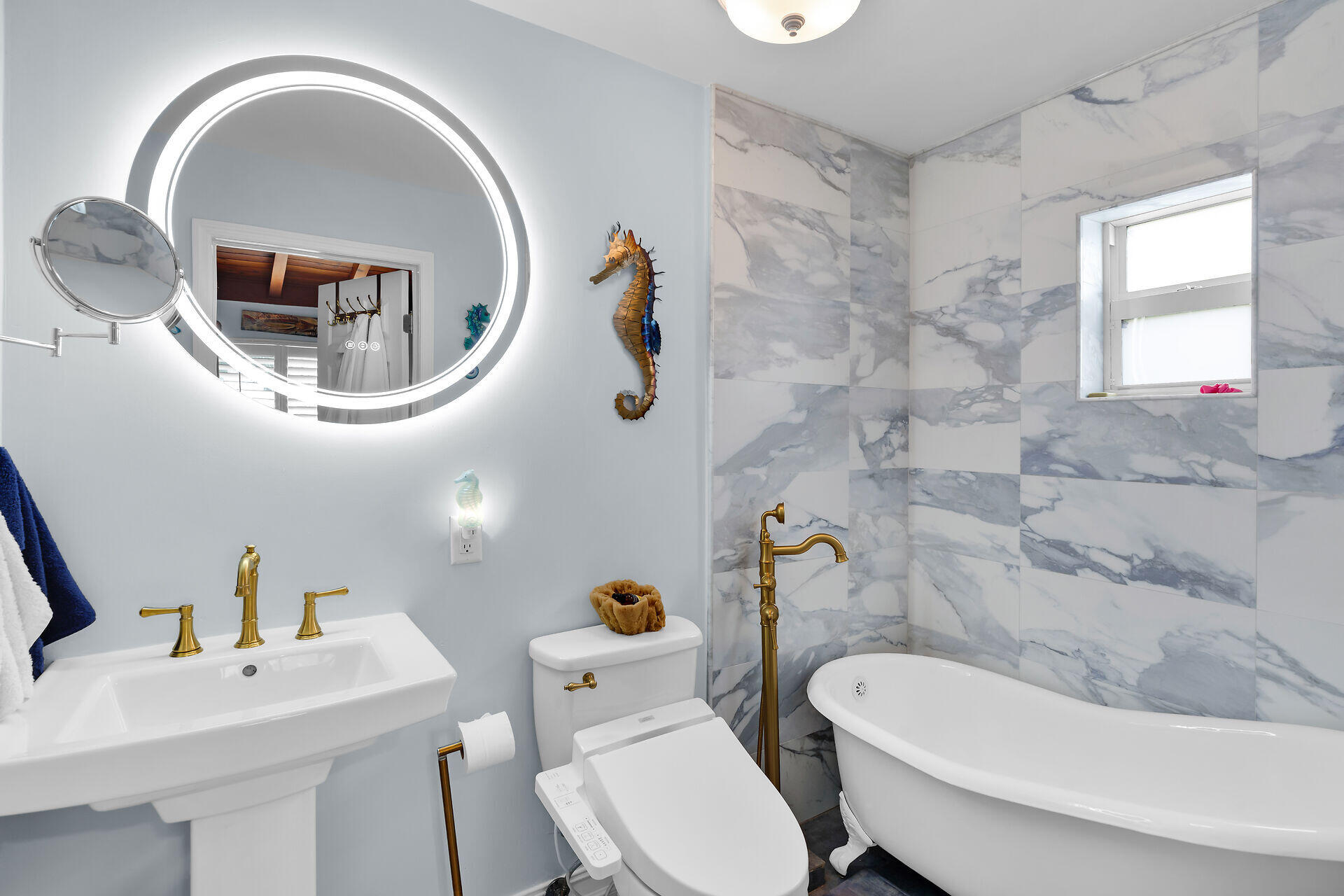 712 Grouper Lane Key Largo, FL 33037 - Photo 42 of 42 a bathroom with a sink a toilet and a mirror