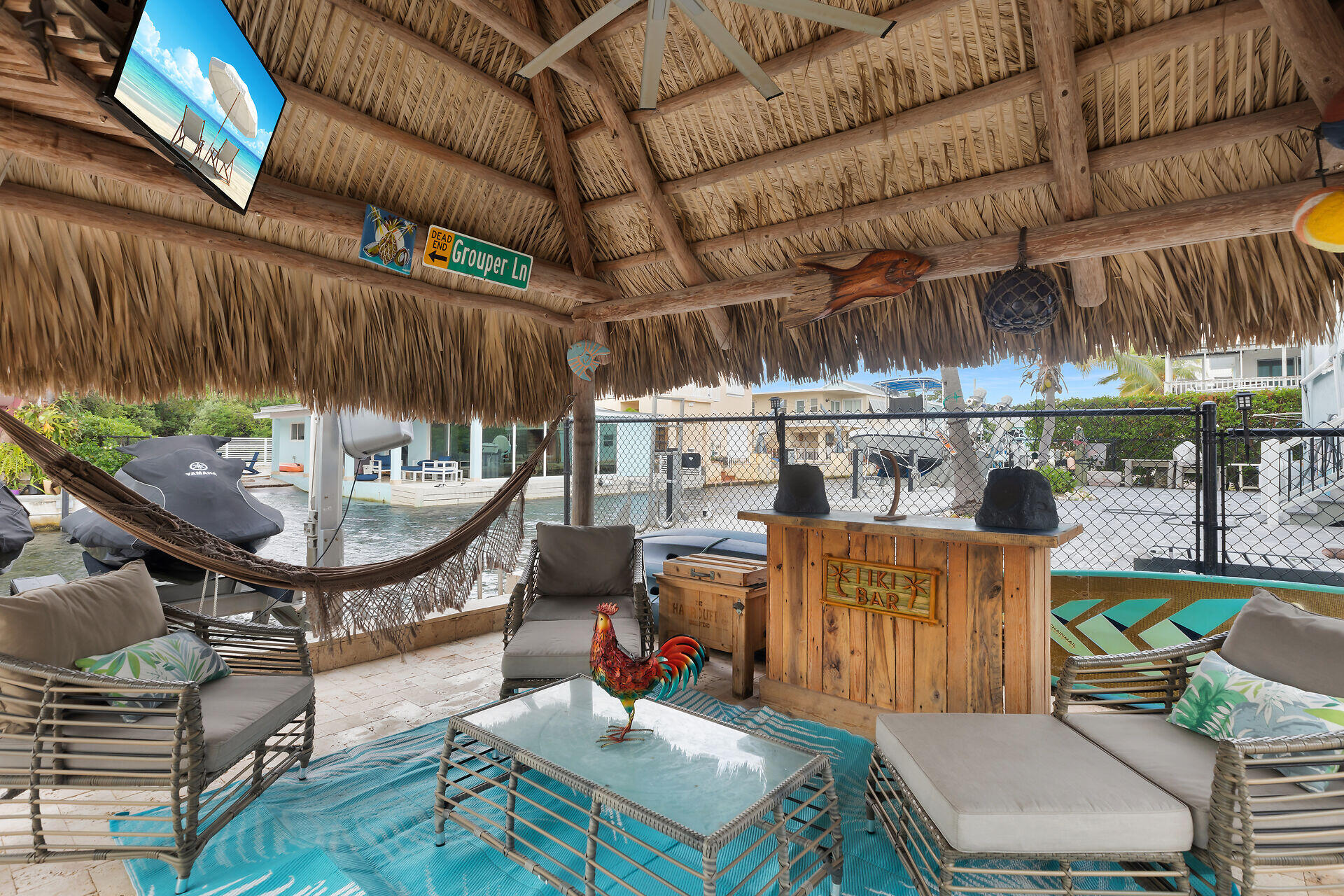 712 Grouper Lane Key Largo, FL 33037 - Photo 6 of 42 a view of a chairs and table in a patio