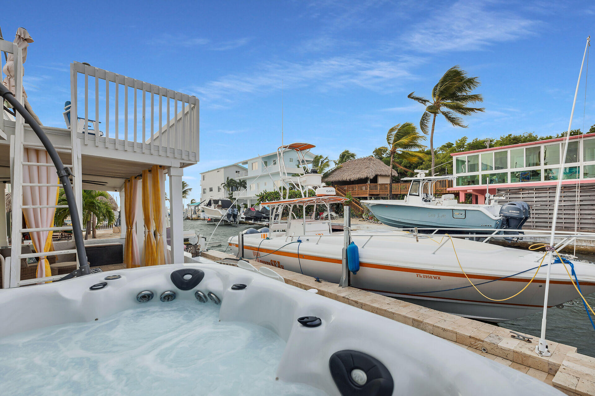 712 Grouper Lane Key Largo, FL 33037 - Photo 7 of 42 a backyard of a house with barbeque oven table and chairs