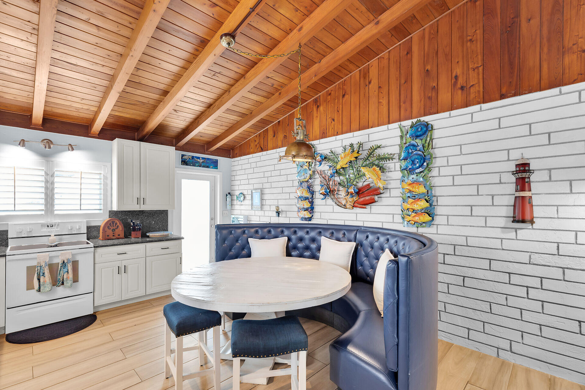 712 Grouper Lane Key Largo, FL 33037 - Photo 9 of 42 a view of a kitchen with a table and chairs in it