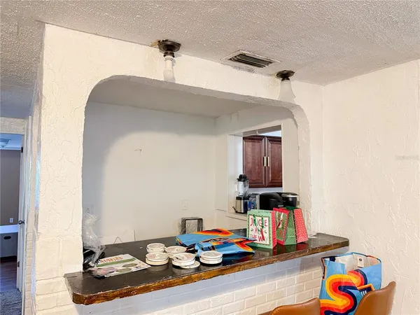 a living room with furniture and gym equipment