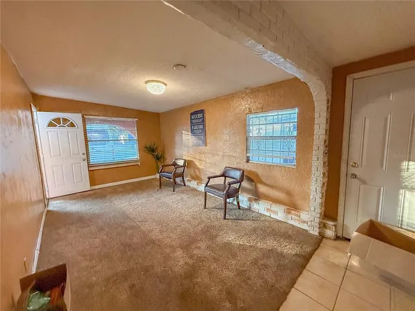 a bedroom with a bed and ceiling fan