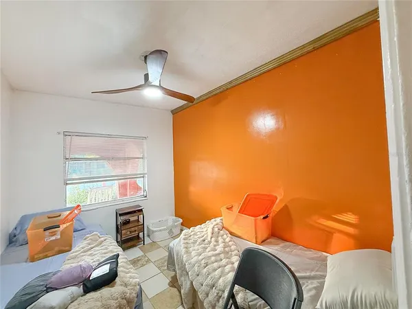a bed room with a bed and a window