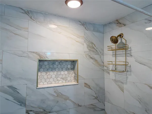 a bathroom with a sink and shower