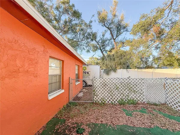 a backyard of a house with seating space