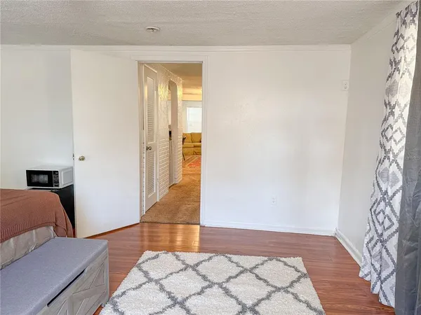 a living room with furniture and a rug