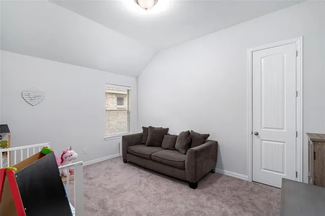 a living room with furniture a window and a couch