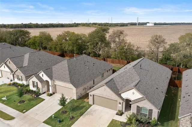 a aerial view of a house with a lake view
