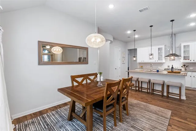 a view of kitchen with cabinets and wooden floor