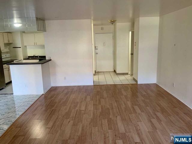 1111 River Road, Unit F2 Edgewater, NJ 07020 - Photo 11 of 21 a view of kitchen with wooden floor
