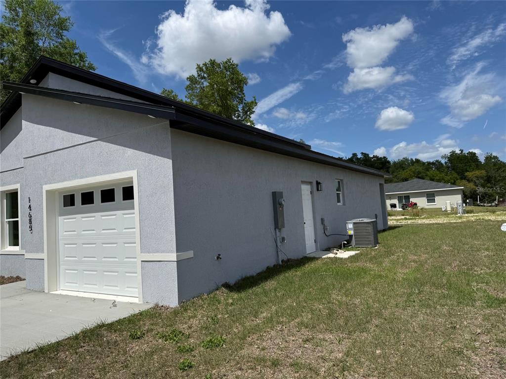 14685 Southwest 22nd Place Ocala, FL 34481 - Photo 2 of 13 a backyard of a house with lots of green space