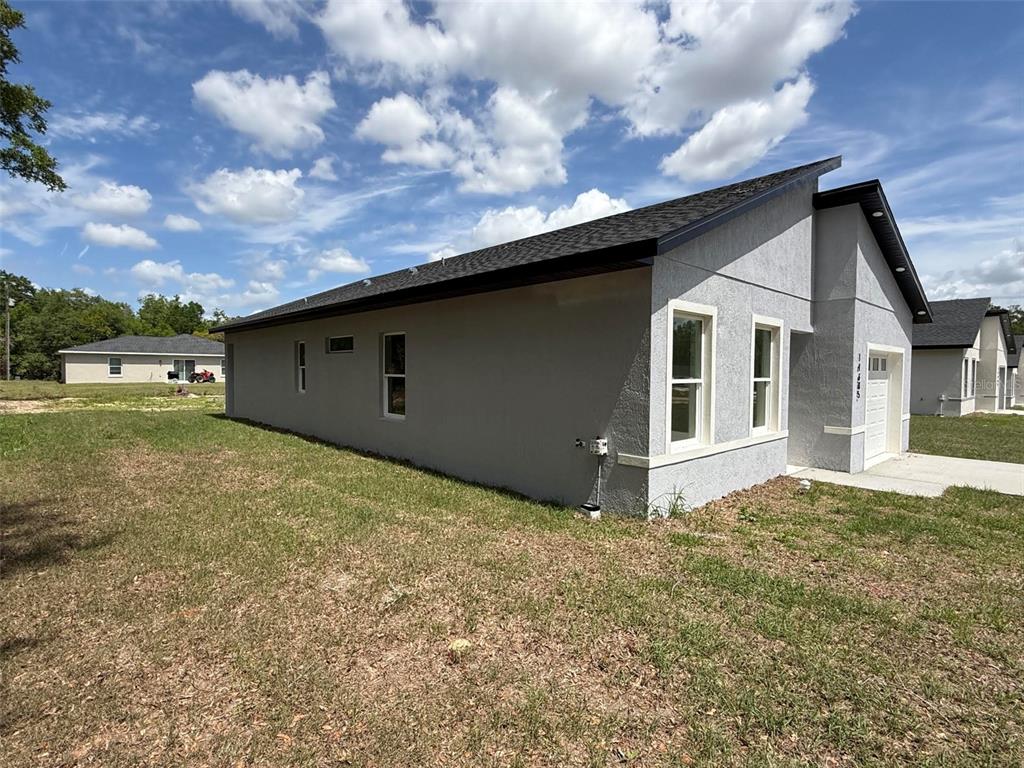 14685 Southwest 22nd Place Ocala, FL 34481 - Photo 3 of 13 a view of a house with a yard