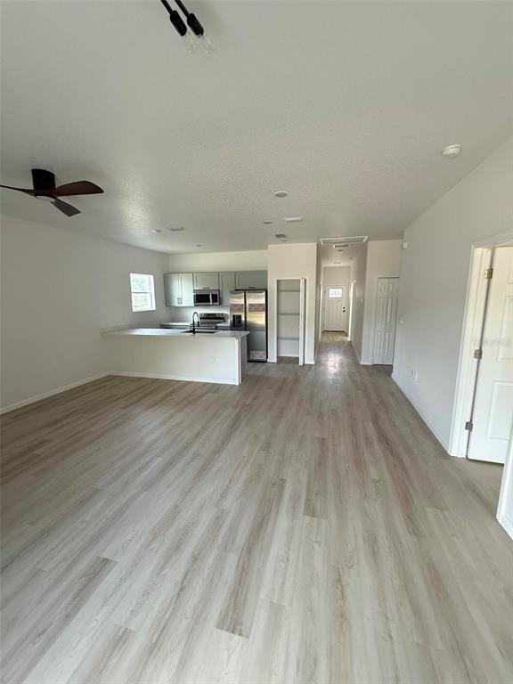 14685 Southwest 22nd Place Ocala, FL 34481 - Photo 6 of 13 wooden floor in an empty room with a window