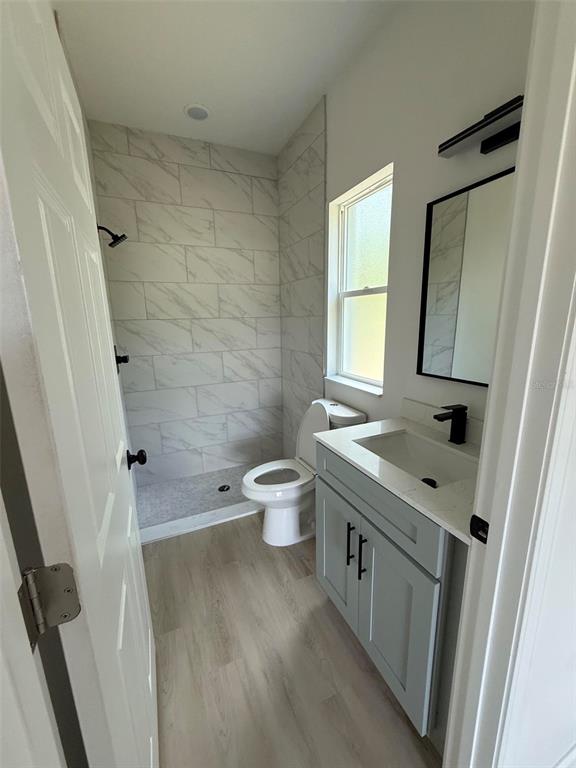 14685 Southwest 22nd Place Ocala, FL 34481 - Photo 8 of 13 a bathroom with a sink a toilet and a mirror