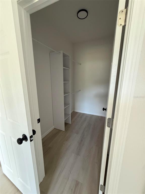 14685 Southwest 22nd Place Ocala, FL 34481 - Photo 9 of 13 an empty room with wooden floor