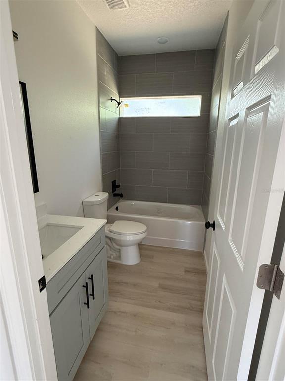 14685 Southwest 22nd Place Ocala, FL 34481 - Photo 10 of 13 a bathroom with a sink a toilet a mirror and shower